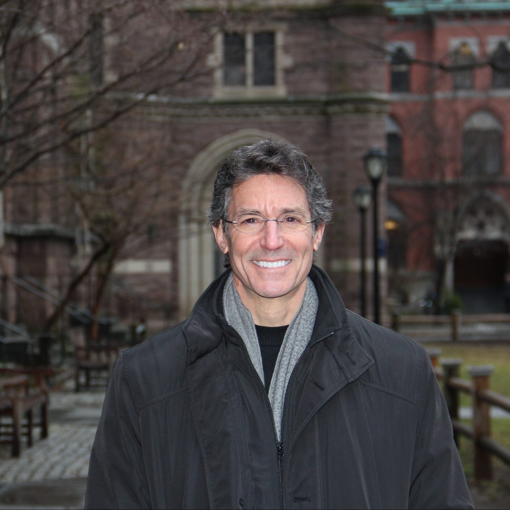 David L Katz MD in winter coat and scarf in front of a building at Yale University January 2020