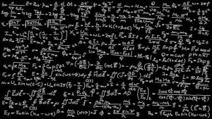 Blackboard covered with mathematical formulas.