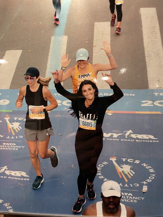 The author's daughter, crossing the NYC Marathon finish line in 2019
